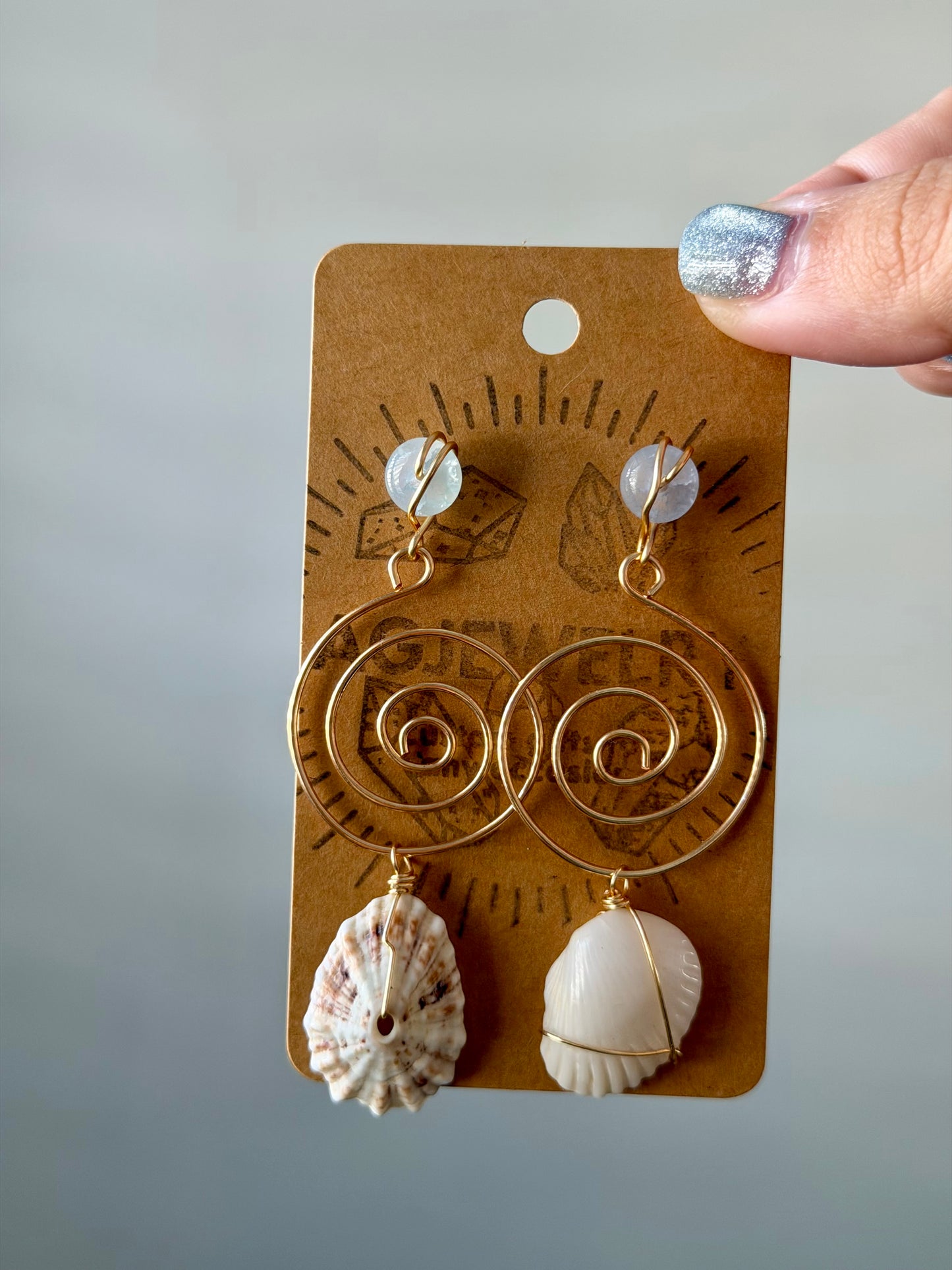 Mismatch Shell swirl earrings