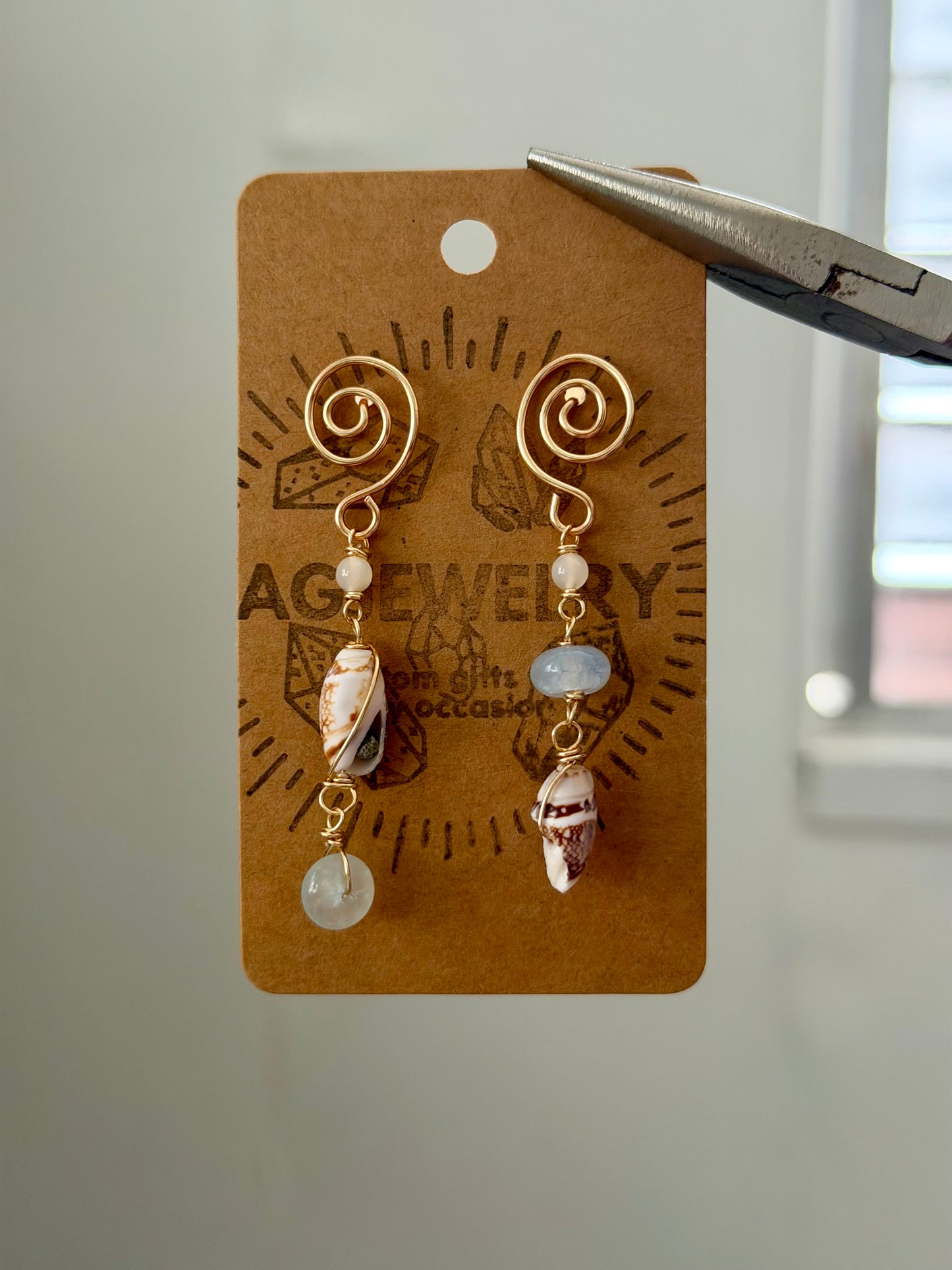 Shell swirl stud earrings